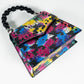 PEARLA HANDBAG | BLACK FLOWER, BLACK HANDLE