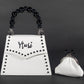 PEARLA HANDBAG | WHITE SNAKE, BLACK PEARL HANDLE